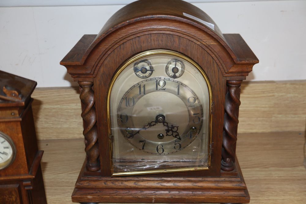 A miniature longcase clock, a wall clock and an oak mantel clock